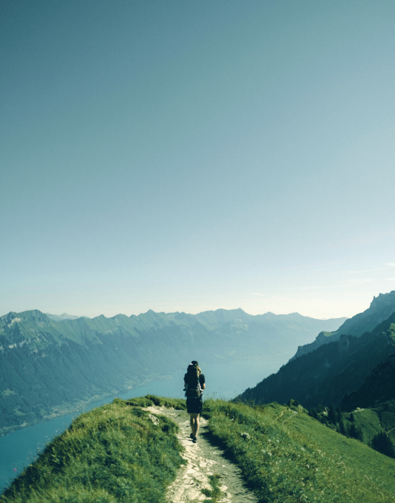 A hiker on a mountain path