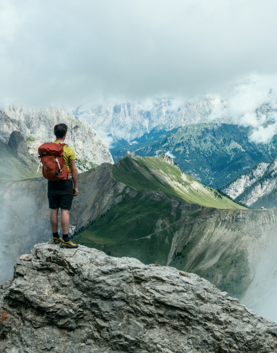 A hiker standing on a cliff
